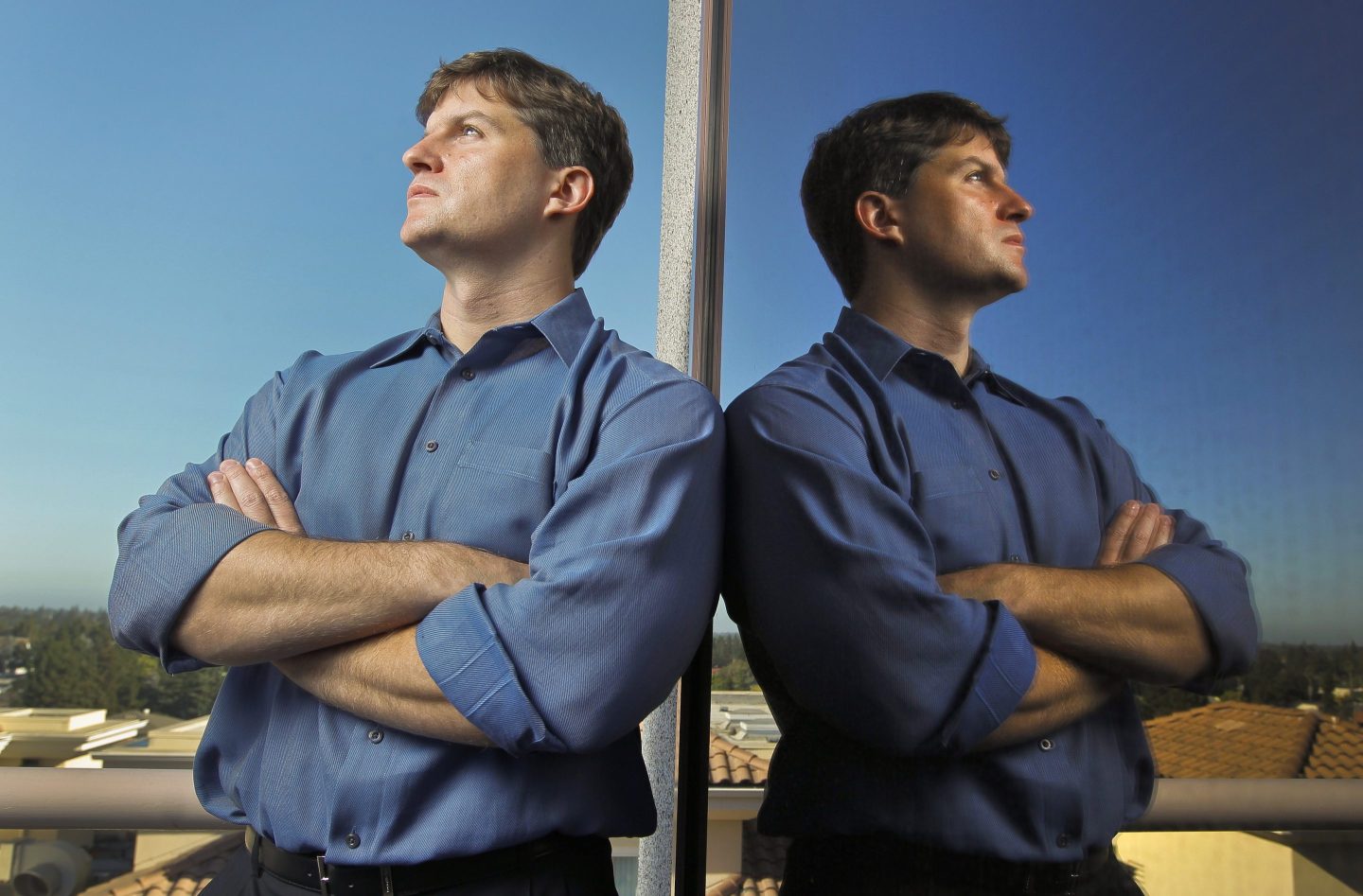 Michael Burry leaning on a wall in contemplation